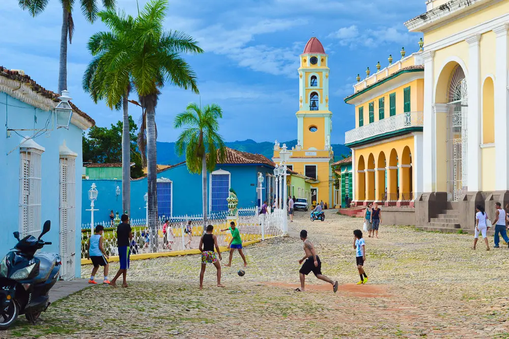 kids playing football on cobbled street in Varadero Cuba