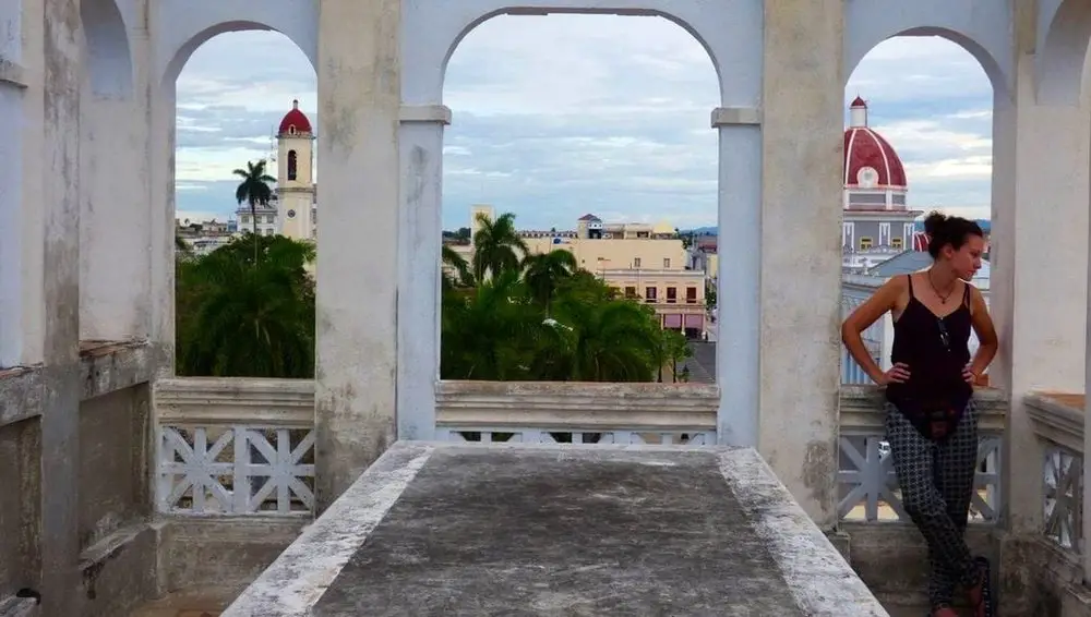 girl in dilapidated building in Cuba