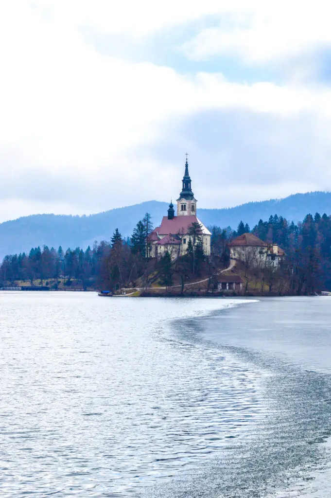 frozen lake bled iin winter with church on island