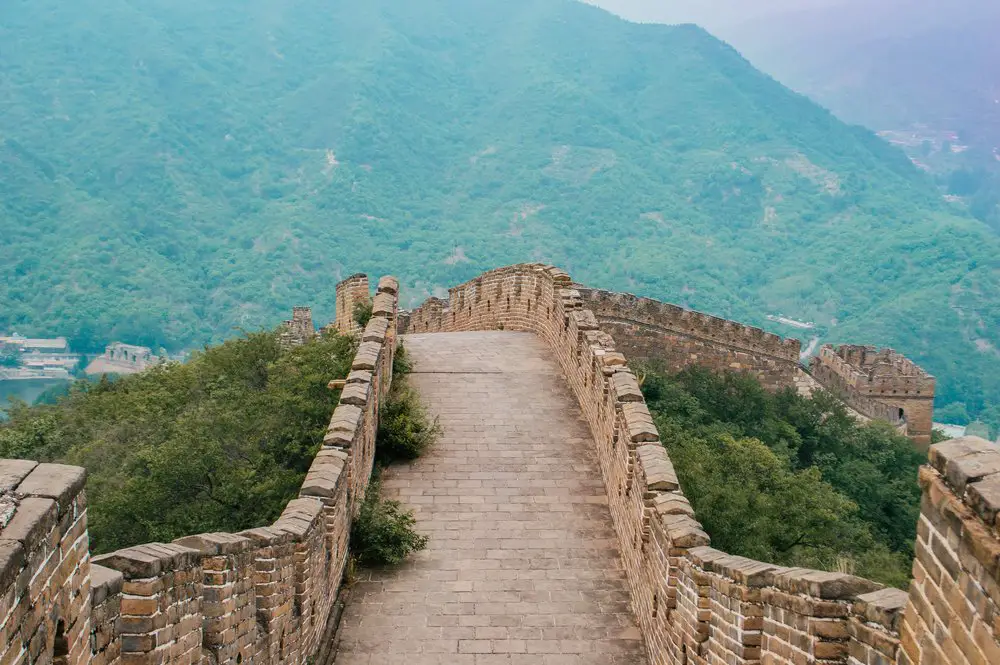 great wall of china stretching over a hill