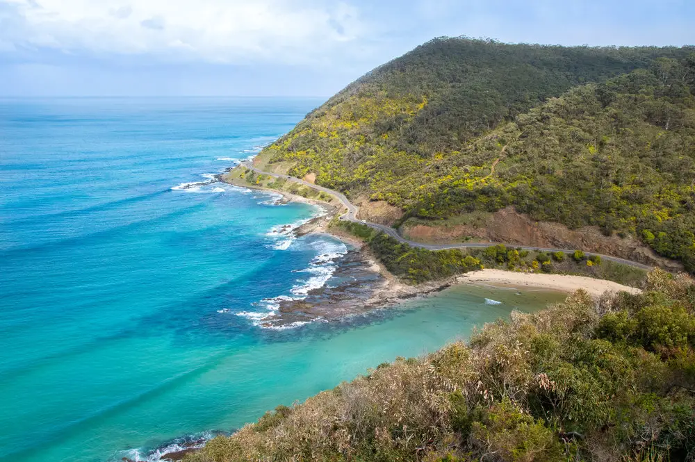 blue water and mountains on coastline