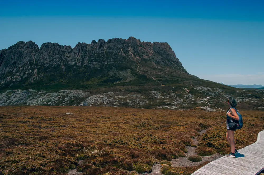 girl hiking cradle mountain in tasmania