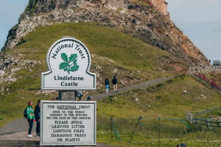 national trust sign against castle backdrop