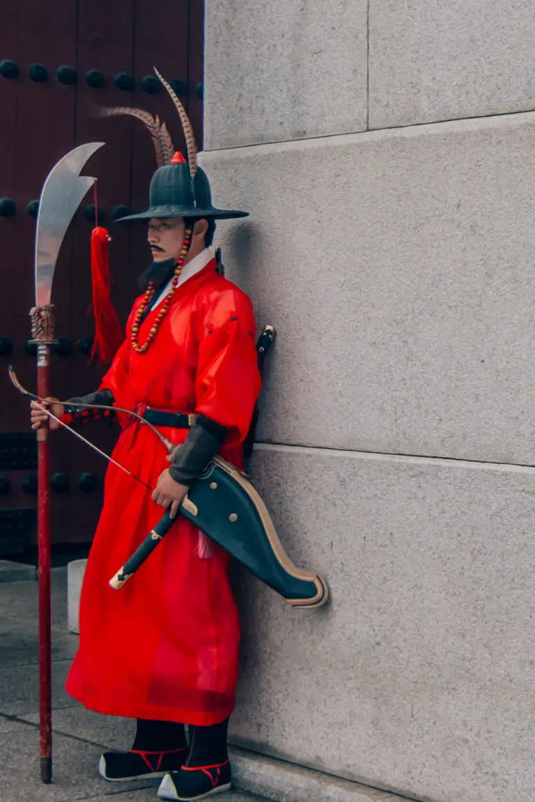guard wearing traditional clothing at ceremony in Seoul