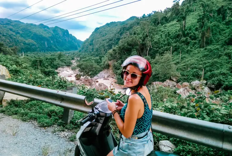 girl on motorbike travelling in Asia