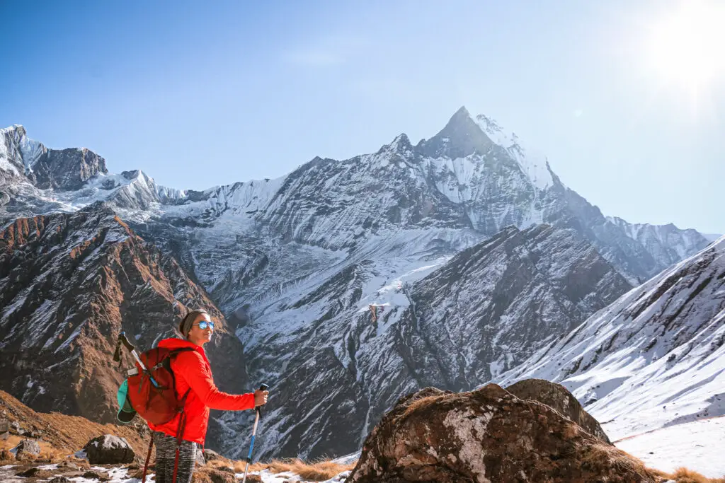 girl hiking on snow capped mountains
