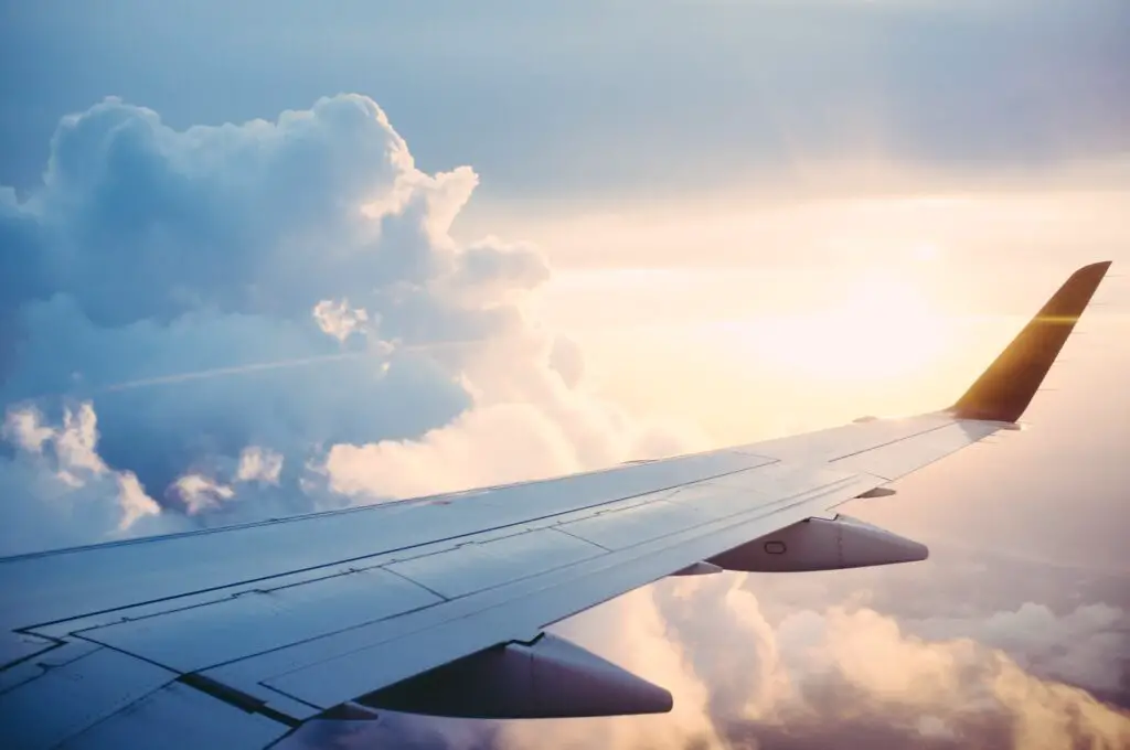 view over airplane wing in the clouds