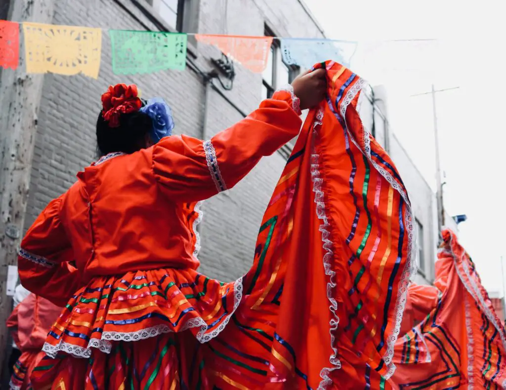 Mexican festival with lady wearing red dress