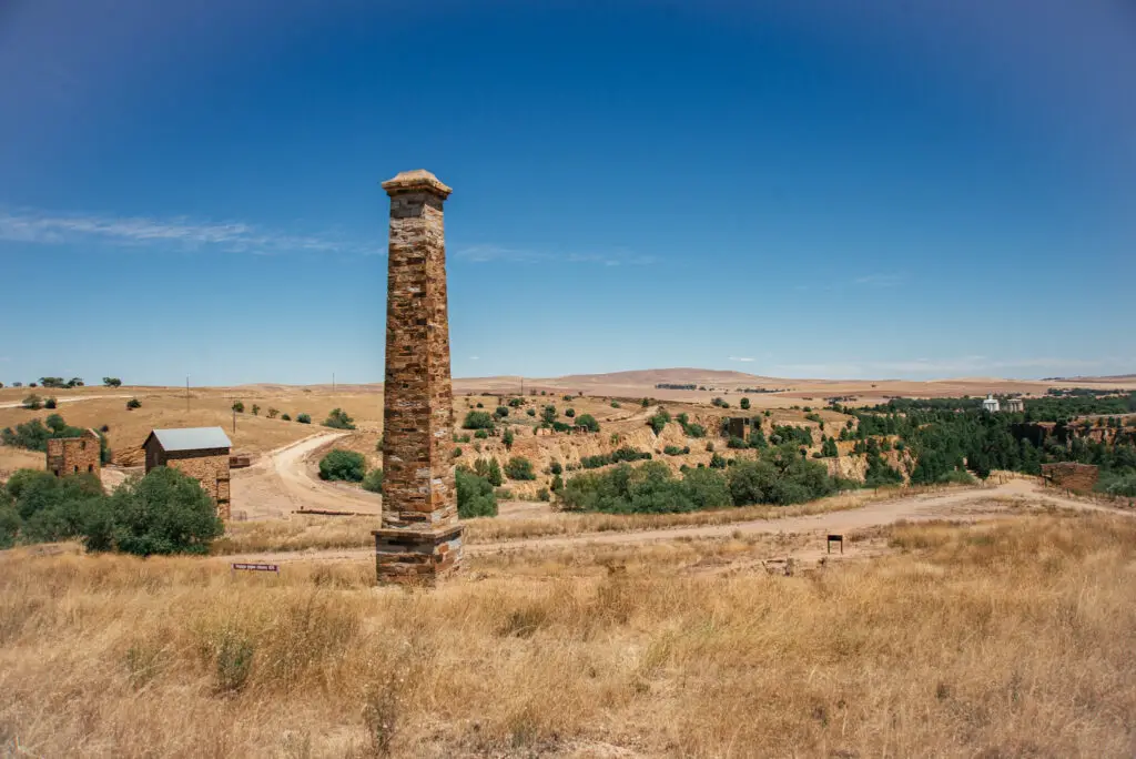 Stone Chimney in Burra with golden hills in the background