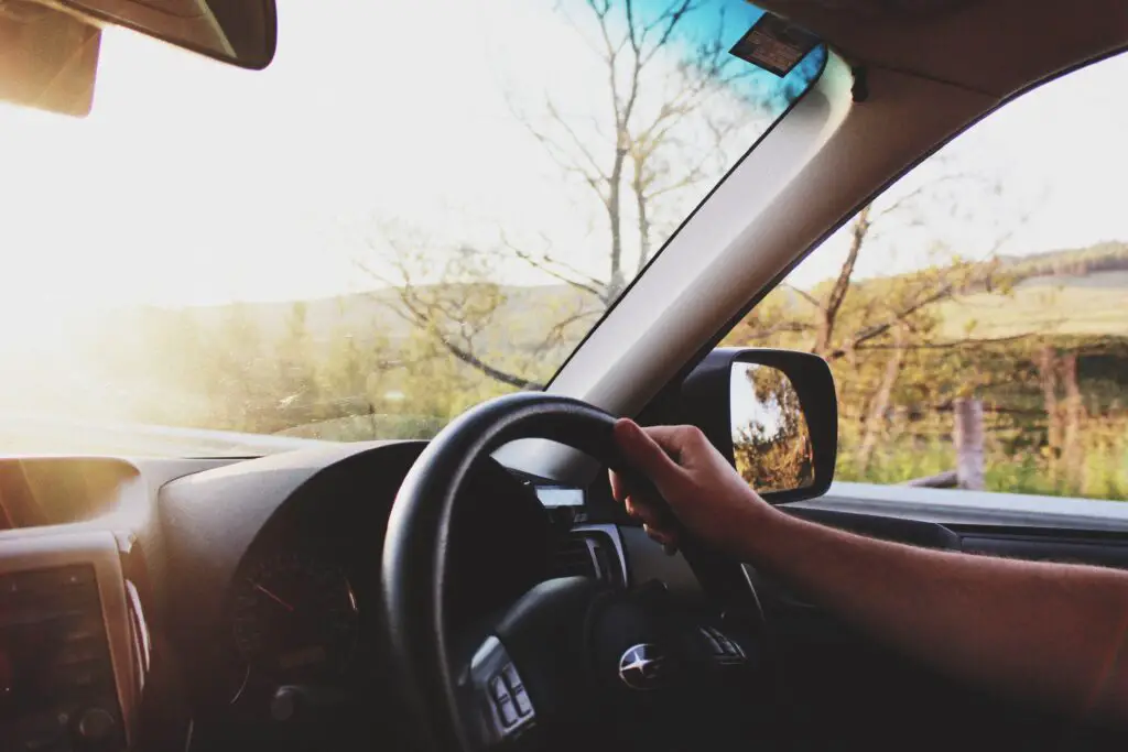 driving in a car with sun shining through windscreen