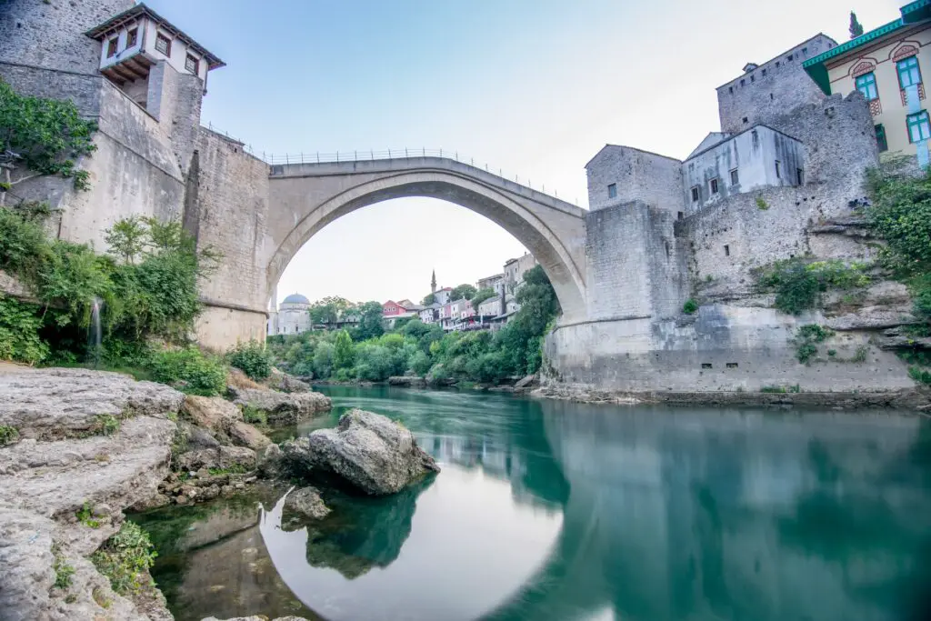 Stone arched bridge above river in Bosnia