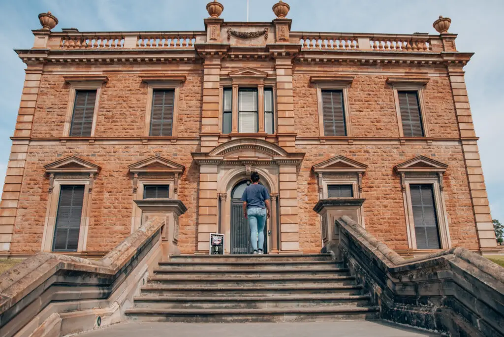 girl walking up steps to martindale hall in South Australia