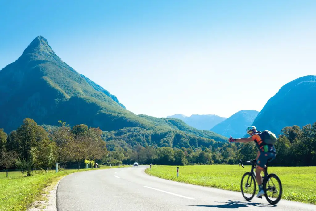 man bike riding in front of mountains