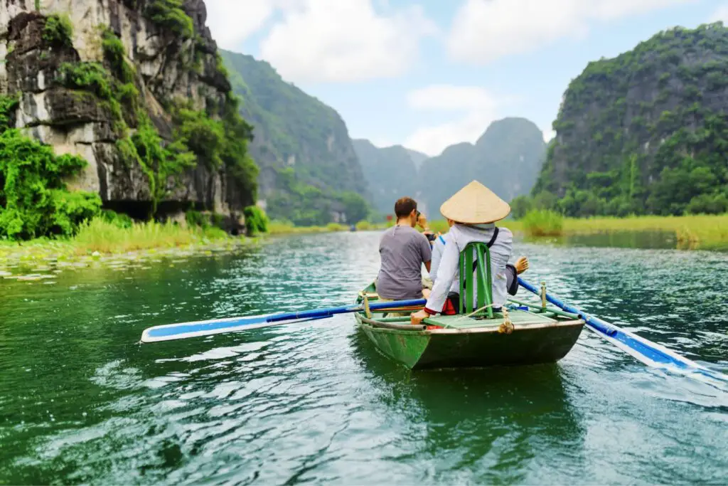 A tourist on a boat in Ha Long Bay in Vietnam